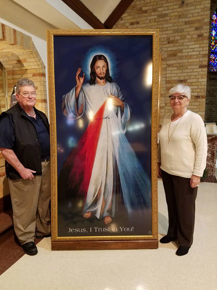 Jerry and Brigitta Gedvillas pictured with the image of Divine Mercy
