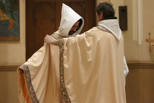Prior Peter invests Fr. Timothy with the chasuble.